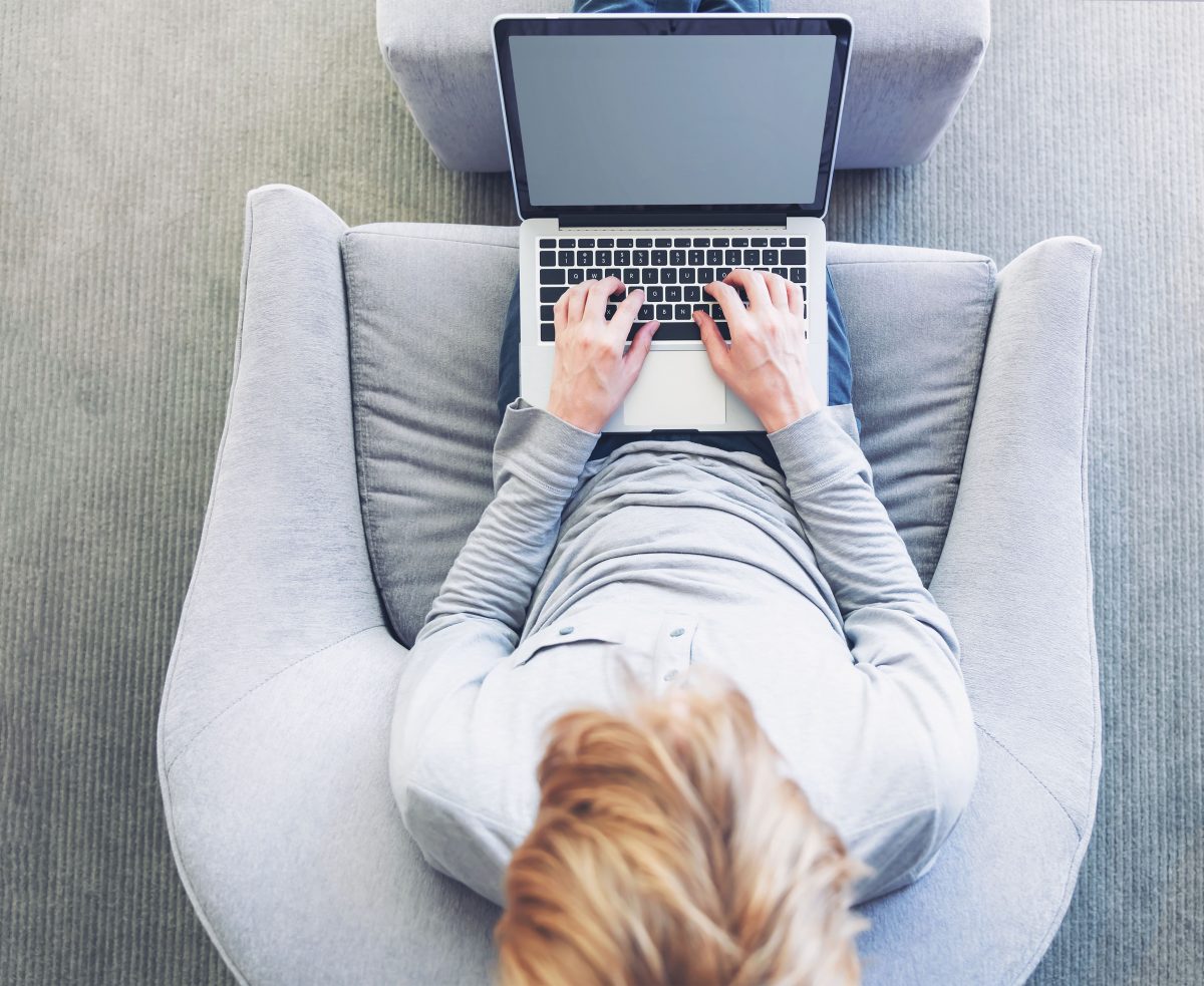 Top down view of person typing on laptop Customer Experience
